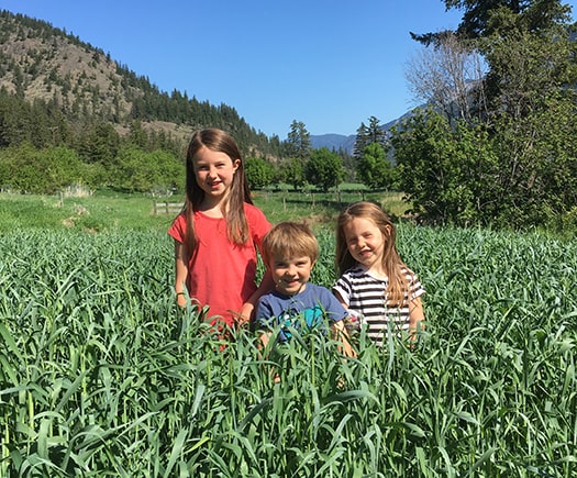 Kids standing in field